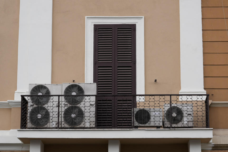 Air conditioning external units are seen on a terrace, in Rome, Tuesday, July 25, 2023. Rising global temperatures are elevating air conditioning from a luxury to a necessity in many parts of Europe, which long has had a conflictual relationship with energy-sucking cooling systems deemed by many a U.S. indulgence. (AP Photo/Andrew Medichini)