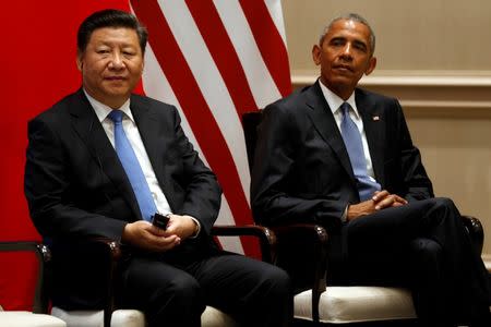 China's President Xi Jinping (L) and U.S. President Barack Obama participate in a Paris Agreements climate event ahead of the G20 Summit, at West Lake State Guest House in Hangzhou, China September 3, 2016. REUTERS/Jonathan Ernst