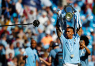 <p>Soccer Football – Premier League – Manchester City vs Huddersfield Town – Etihad Stadium, Manchester, Britain – May 6, 2018 Manchester City’s Gabriel Jesus celebrates with the trophy after winning the Premier League title REUTERS/Phil Noble EDITORIAL USE ONLY. No use with unauthorized audio, video, data, fixture lists, club/league logos or “live” services. Online in-match use limited to 75 images, no video emulation. No use in betting, games or single club/league/player publications. Please contact your account representative for further details. </p>