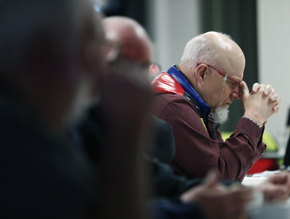 The Rev. Jack Lamb, a retired Presbyterian minister, takes part in a prayer gathering with Catholic and Protestant clergy at Duncairn in north Belfast, Northern Ireland, Friday, Jan. 27, 2023. Twenty-five years ago, the Good Friday Agreement halted much of the violence of Northern Ireland’s Troubles. Today, grassroots faith leaders are trying to build on that opportunity. They're working toward reconciliation in a land where religion was often part of the problem. (AP Photo/Peter Morrison)