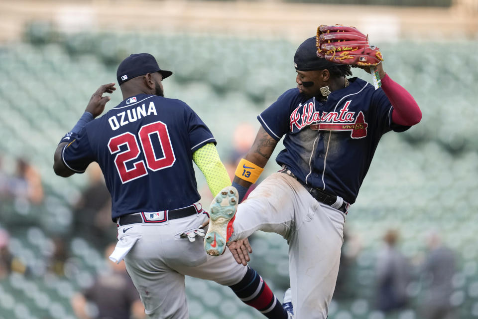 Atlanta Braves' Marcell Ozuna (20) and Ronald Acuna Jr. celebrate after the final out against the Detroit Tigers in the ninth inning during the second baseball game of a doubleheader, Wednesday, June 14, 2023, in Detroit. (AP Photo/Paul Sancya)