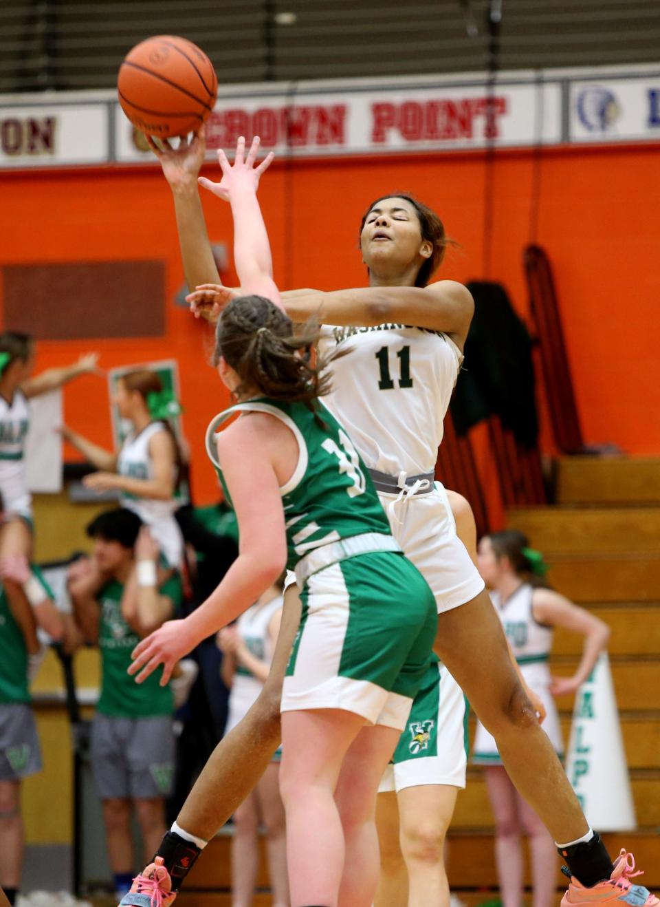WashingtonÕs Kira Reynolds (11) shoots Saturday, Feb. 11, 2023, at the girls 4A basketball regional game at LaPorte High School. Washington won, 60-41, to advance.