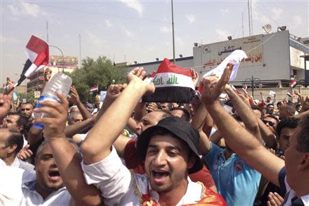 Protesters demand that the pensions of parliamentarians be cancelled during a demonstration in Baghdad August 31, 2013. Thousands are rallying across Iraq against corruption and the financial privileges of lawmakers and political leaders. REUTERS/Thaier al-Sudani