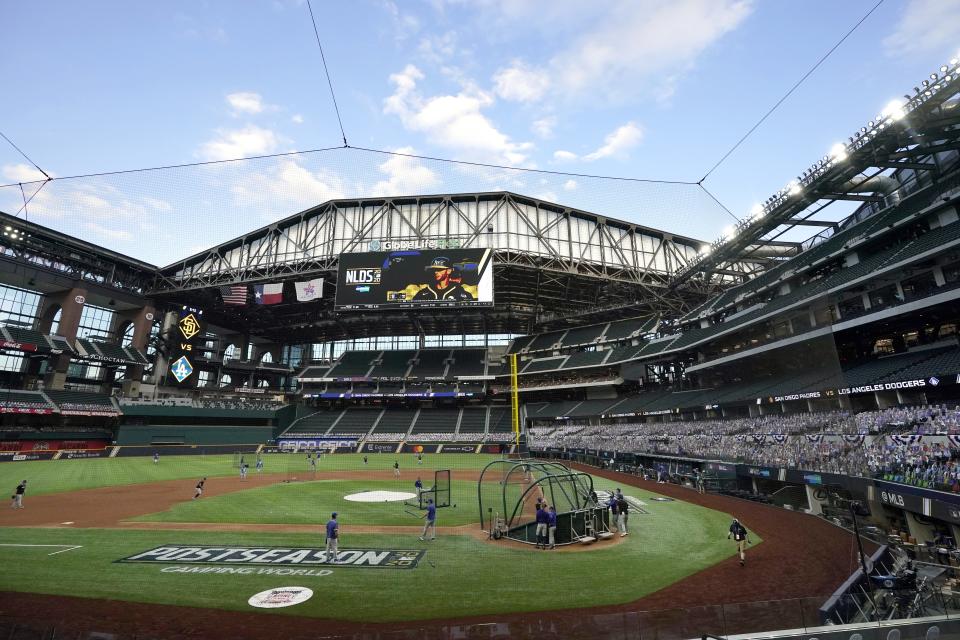 The roof at Globe Life Field is opened as the Los Angeles Dodgers take batting practice before Game 3 of the baseball team's NL Division Series against the San Diego Padres on Thursday, Oct. 8, 2020, in Arlington, Texas. (AP Photo/Tony Gutierrez)