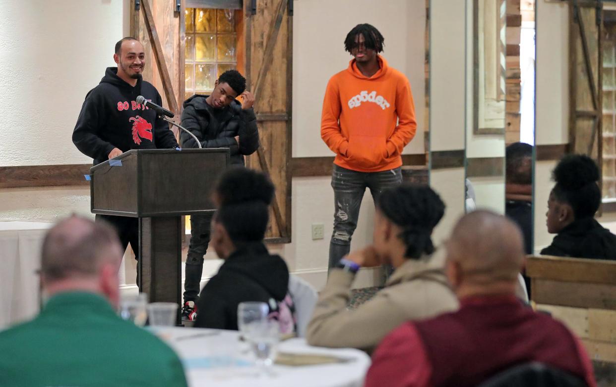 East boys basketball coach Christopher Munford cracks a smile as he jokes about his age during the Akron City Series high school basketball media day at Guy's Party Center on Tuesday in Akron.