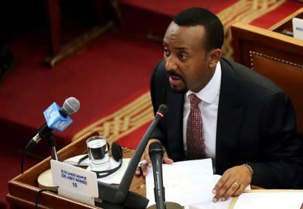 FILE PHOTO: Ethiopia's newly elected Prime Minister Abiy Ahmed addresses the members of parliament inside the House of Peoples' Representatives in Addis Ababa, Ethiopia April 19, 2018. REUTERS/Tiksa Negeri/File Photo