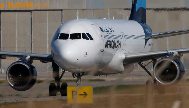 FILE PHOTO: A hijacked Libyan Afriqiyah Airways Airbus A320 stands on the runway at Malta Airport
