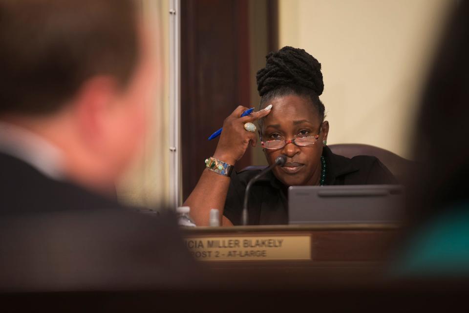 At-Large Alderwoman Alicia Miller Blakely looks on as City Manager Jay Melder explains details of the city's Memorandum of Understanding with the U.S. Attorney's Office at Thursday's City Council meeting. 