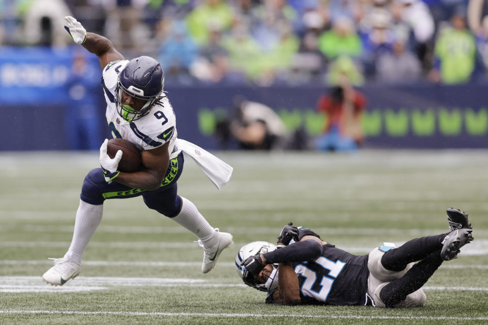 Seattle Seahawks running back Kenneth Walker III breaks away from Carolina Panthers safety Jeremy Chinn during the second half of an NFL football game Sunday, Sept. 24, 2023, in Seattle. (AP Photo/John Froschauer)