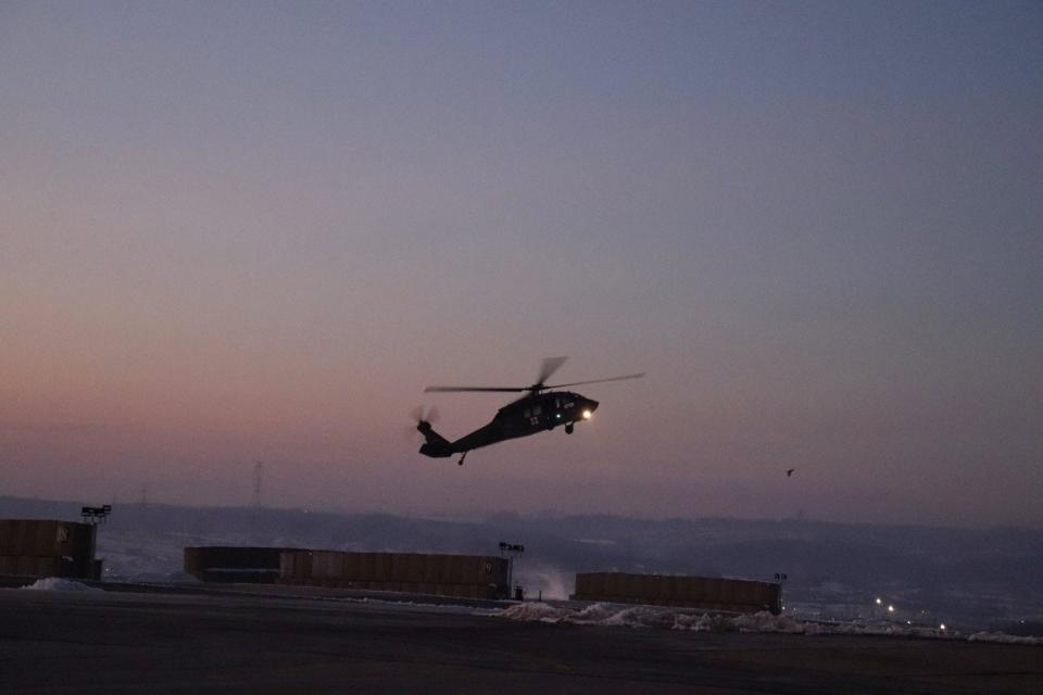 A Rhode Island Army National Guard aircrew returns to Camp Bondsteel in southeastern Kosovo after participating in the rescue of two avalanche survivors in neighboring Albania.