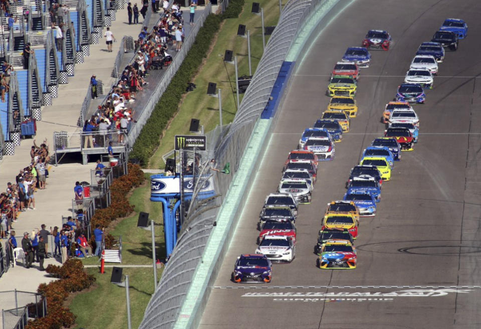 Cars get the green flag during a NASCAR Cup Series Championship auto race at Homestead-Miami Speedway, Sunday, Nov. 18, 2018, in Homestead, Fla. (AP Photo/Jim Topper)