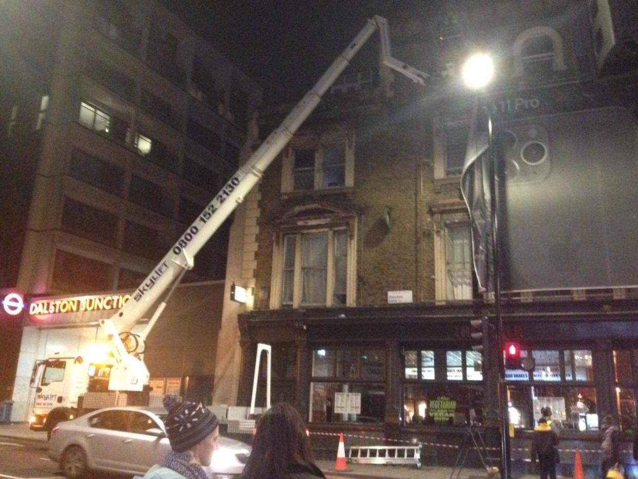 An iPhone advert that blocked daylight to families living in a London apartment block has been taken down: Alex Armitage