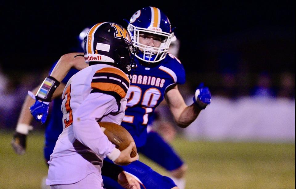 Boonsboro’s Gabriel Smith looks to tackle Middletown’s Camden Baker late in the second quarter on Sept. 23, 2022.