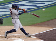 Houston Astros Jose Altuve hits a solo home run during the inning in Game 1 of a baseball American League Championship Series against the Tampa Bay Rays, Sunday, Oct. 11, 2020, in San Diego. (AP Photo/Ashley Landis)