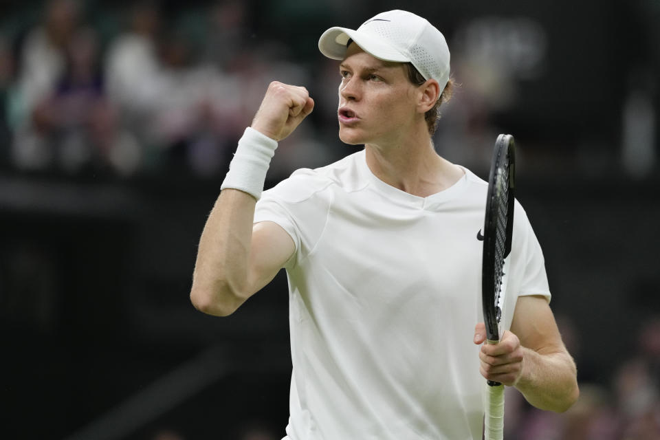 Jannik Sinner of Italy reacts after winning a point during his second round match against compatriot Matteo Berrettini on day three at the Wimbledon tennis championships in London, Wednesday, July 3, 2024. (AP Photo/Alberto Pezzali)