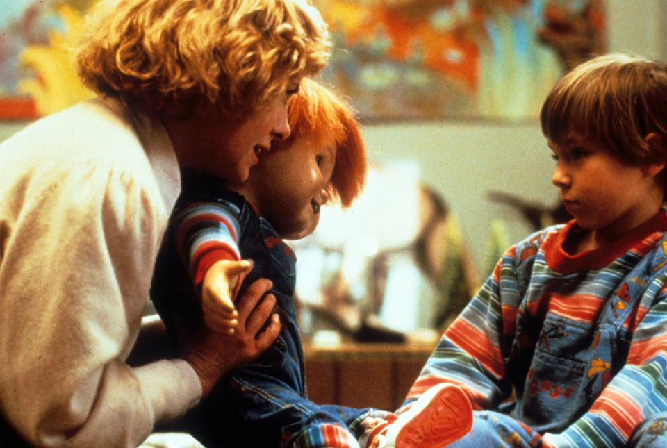 Actress Catherine Hicks and child actor Alex Vincent with Chucky in a scene from the film 'Child's Play', 1988. (Photo by United Artists/Getty Images)