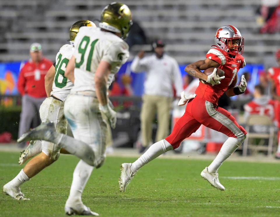 Saraland's Ryan Williams carries the ball against Mountain Brook during the AHSAA Class 6A State Football Championship Game at Jordan Hare Stadium in Auburn, Ala., on Friday December 2, 2022.