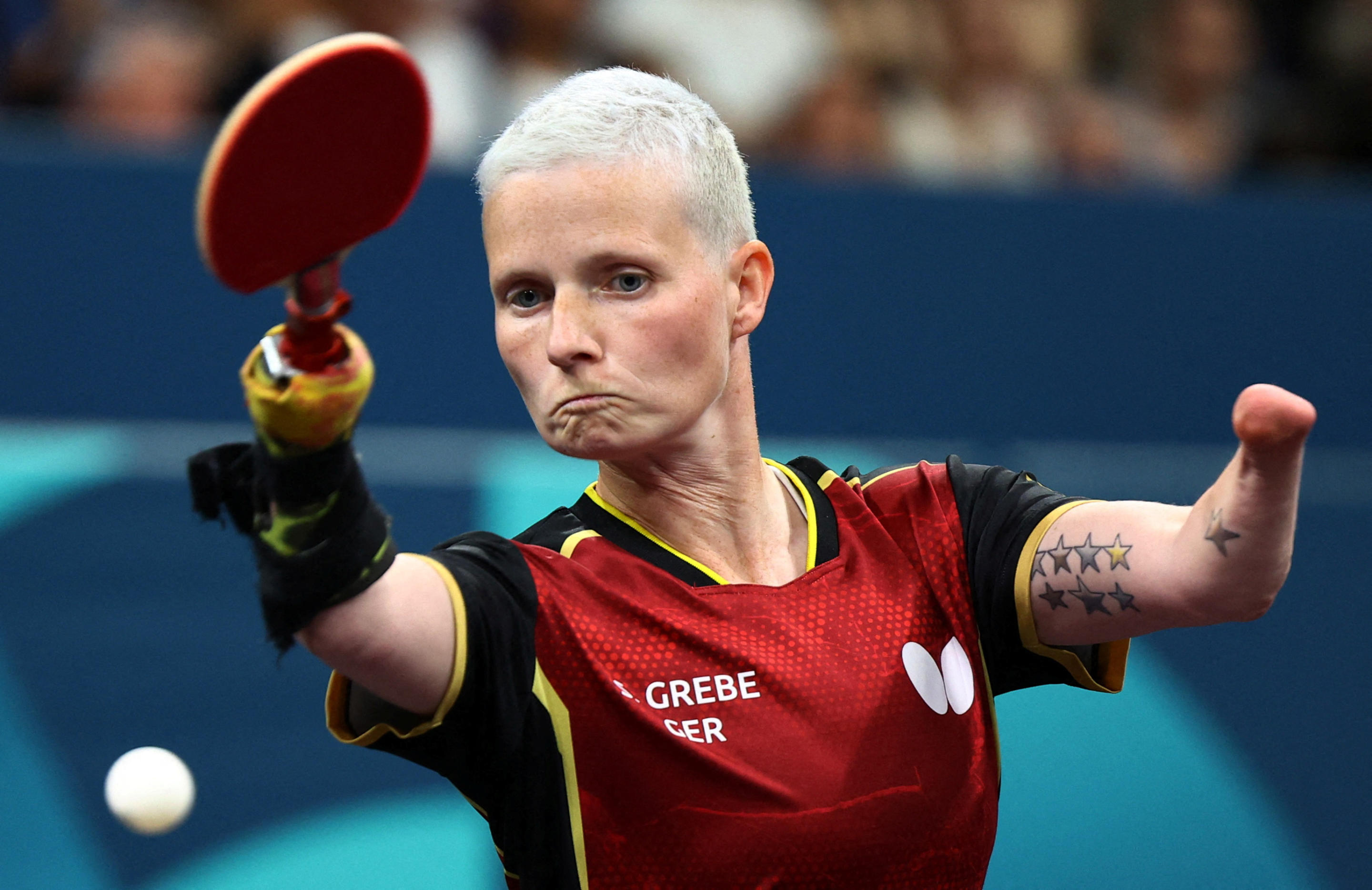 A woman plays table tennis.