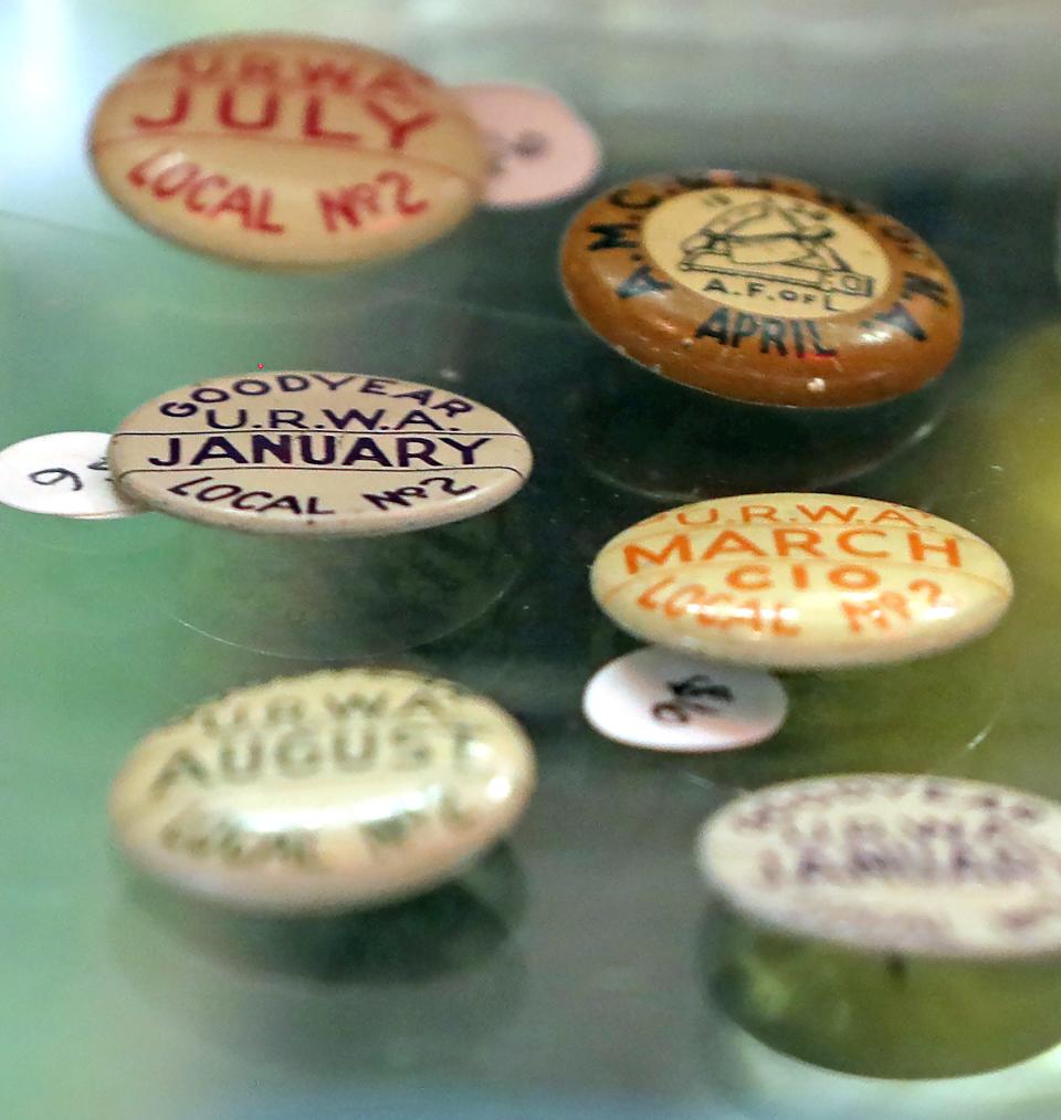 Old Goodyear union pins for sale at The Bomb Shelter, Thursday, Feb. 2, 2023, in Akron, Ohio.