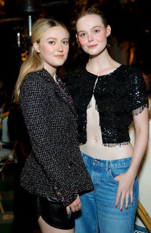 <p>Stefanie Keenan/WireImage</p> Dakota Fanning and Elle Fanning attend the CHANEL dinner to celebrate the launch of Sofia Coppola Archive