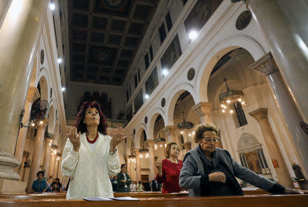 Christian women pray at Saint Joseph's Roman Catholic Church before Pope Francis is scheduled to visit Egypt, in Cairo, Egypt April 23, 2017. Picture taken April 23, 2017. REUTERS/Mohamed Abd El Ghany