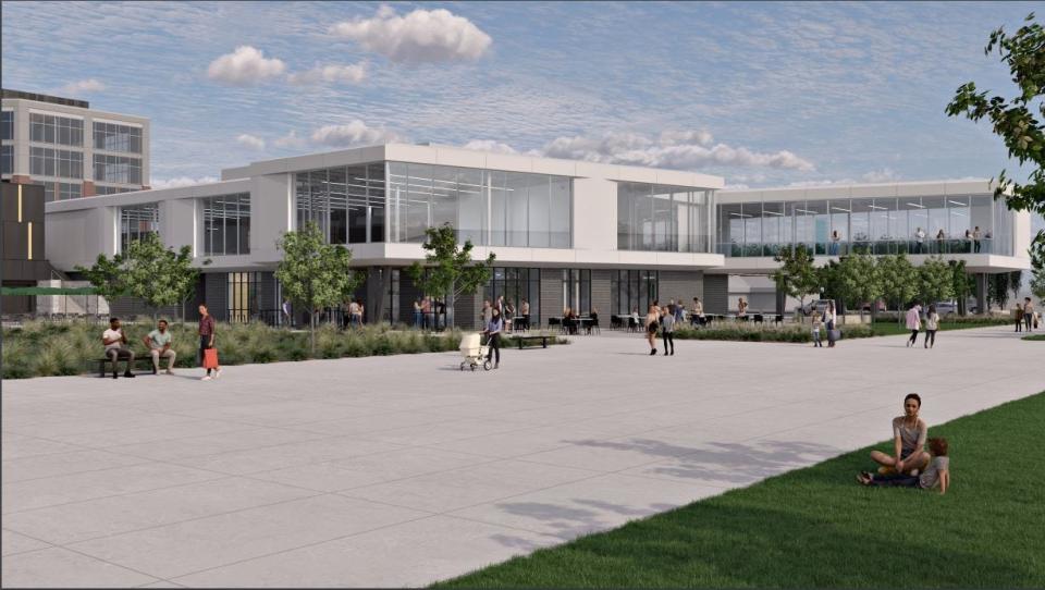 A rendering of the Titletown Fitness building looking northwest from the Titletown District football field. The two-story building would be located east of the U.S. Venture office building, part of which can be seen in the background.