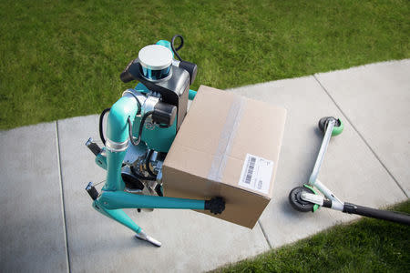 An undated handout image of Digit, a two-legged walking robot that can lift packages that weigh up to 40 pounds. Tim LaBarge/Ford/Handout via REUTERS