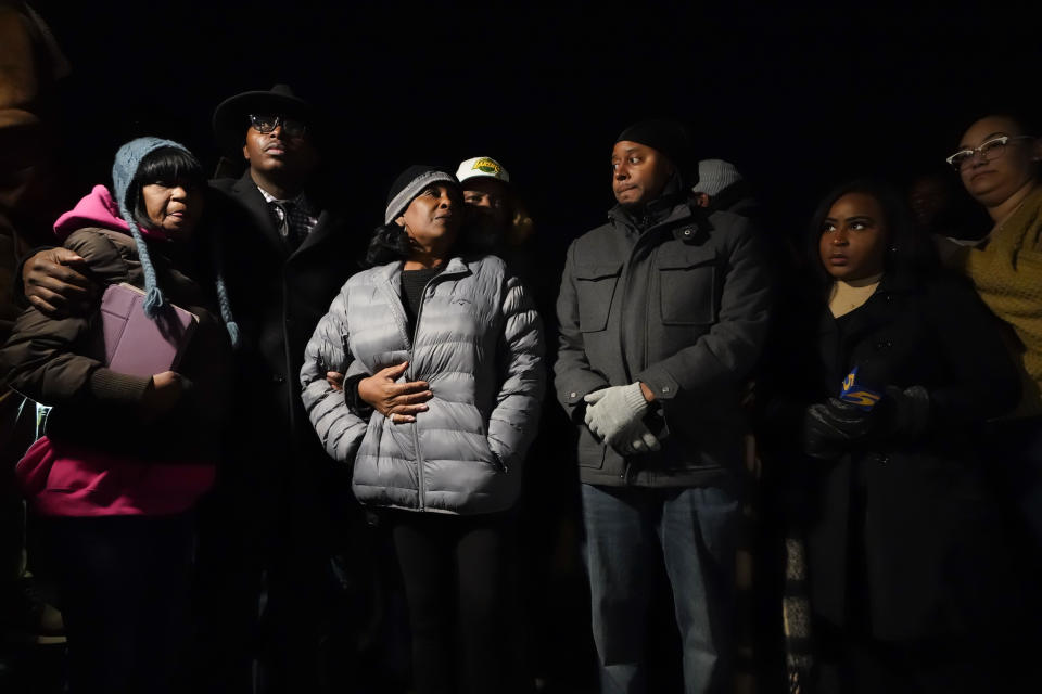 RowVaughn Wells, center, mother of Tyre Nichols, who died after being beaten by Memphis police officers, is comforted by his stepfather Rodney Wells, at the conclusion of a candlelight vigil for Tyre, in Memphis, Tenn., Thursday, Jan. 26, 2023. (AP Photo/Gerald Herbert)