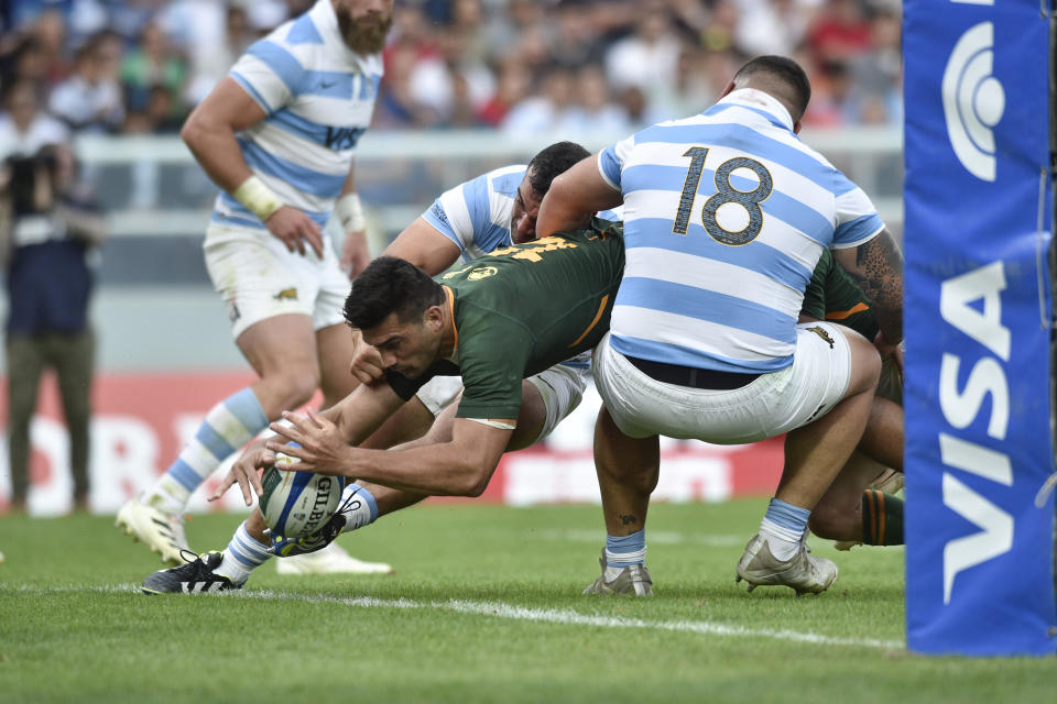 South Africa's Damian De Allende marks a try as he is tackled by Argentina's Los Pumas Joel Sclavi, right during a rugby championship match in Buenos Aires, Argentina, Saturday, Sept. 17, 2022. (AP Photo/Gustavo Garello)