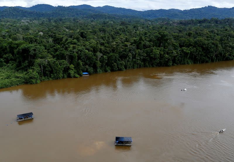 FILE PHOTO: A gold dredge is seen at the banks of Uraricoera River during Brazil's environmental agency operation against illegal gold mining on indigenous land, in the heart of the Amazon rainforest