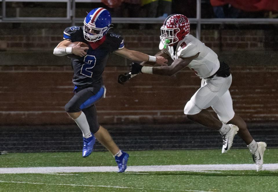 Lake’s Nathan Baker is pushed out of bounds by Westerville South’s Preston Penn after gaining 60 yards on a pass reception Friday, Nov. 11, 2022.