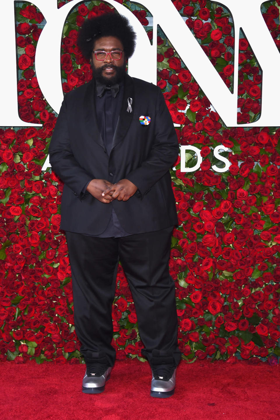 Questlove paired a black tuxedo with metallic sneakers 