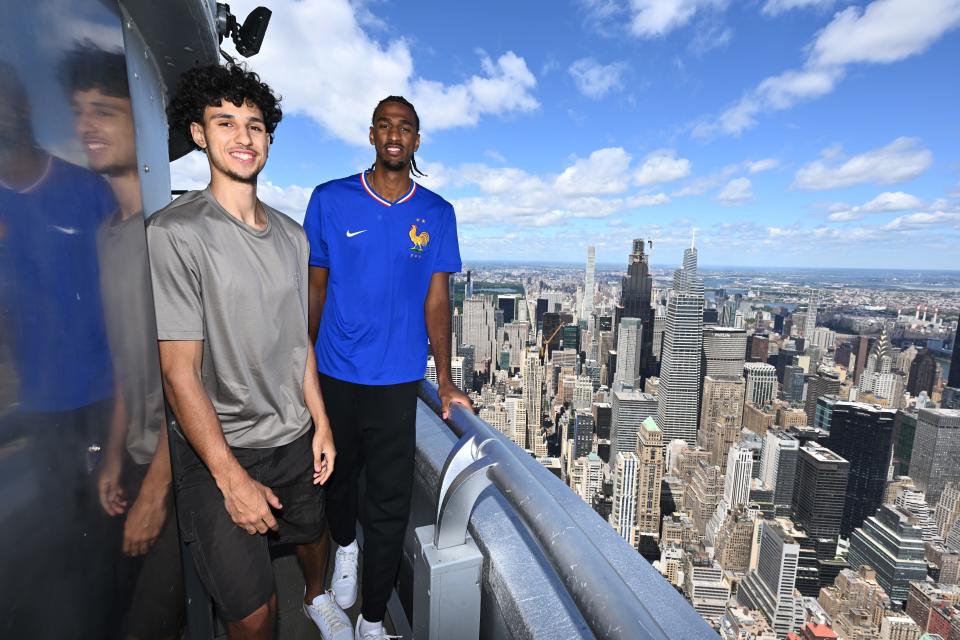 Zaccharie Risacher, left, and Alex Sarr, shown here during a visit to the Empire State Building, are expected to be among the top picks in the NBA draft.
