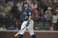 Seattle Mariners' Cal Raleigh walks off the field after he struck out swinging with the bases loaded to end the eighth inning of the team's baseball game against the Houston Astros, Friday, July 22, 2022, in Seattle. (AP Photo/Ted S. Warren)