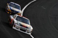 CHARLOTTE, NC - MAY 19: Jamie McMurray, driver of the #1 Bass Pro Shops/Allstate Chevrolet, and Martin Truex Jr., driver of the #56 NAPA Auto Parts Toyota, race during the NASCAR Sprint Showdown at Charlotte Motor Speedway on May 19, 2012 in Charlotte, North Carolina. (Photo by Jeff Zelevansky/Getty Images for NASCAR)