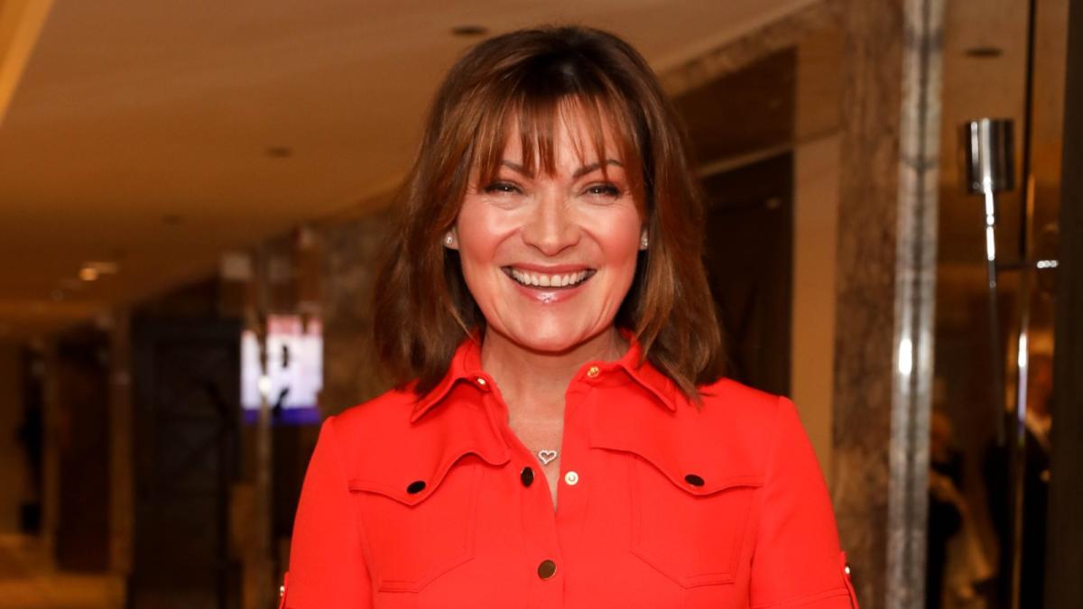 Lorraine Kelly just wore the most flattering puff sleeve dress in bright orange from the high street