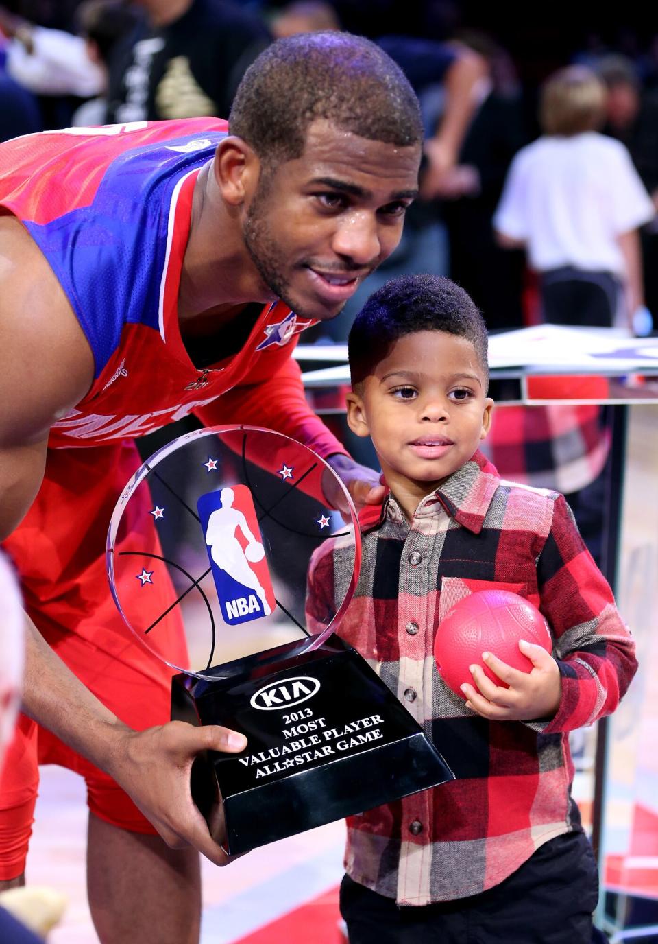 Chris Paul #3 of the Los Angeles Clippers and the Western Conference celebrates with son Christopher Emmanuel Paul ll after winning MVP in the 2013 NBA All-Star game at the Toyota Center on February 17, 2013 in Houston, Texas. NOTE TO USER: User expressly acknowledges and agrees that, by downloading and or using this photograph, User is consenting to the terms and conditions of the Getty Images License Agreement