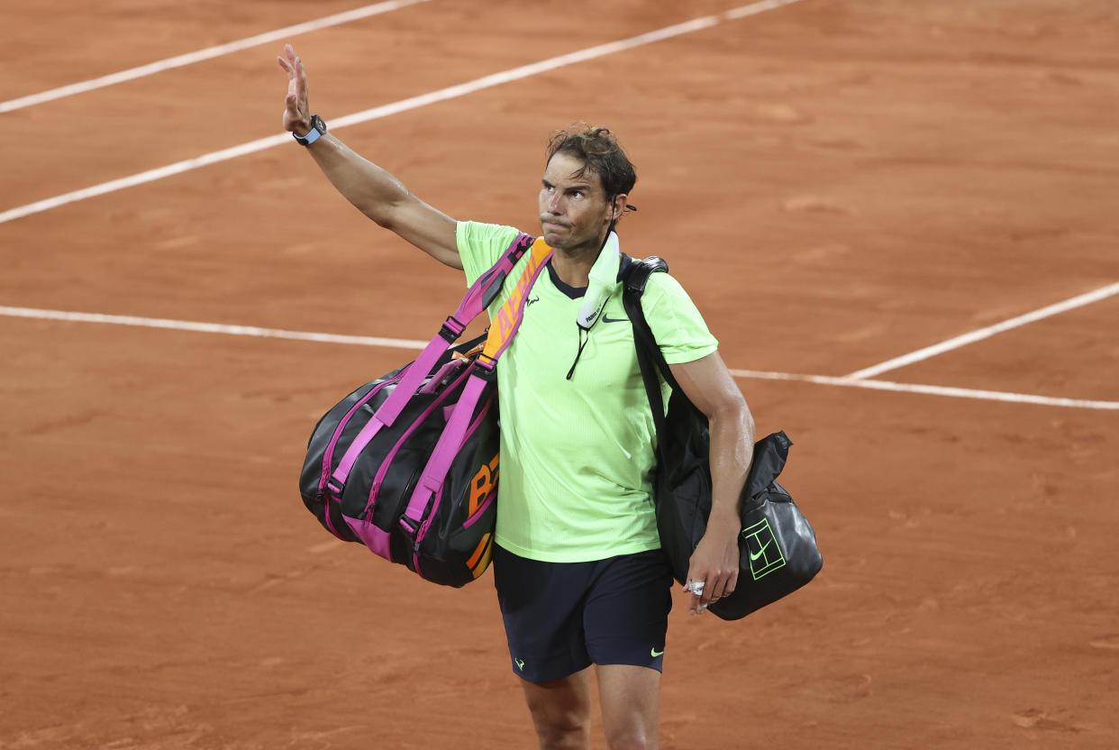 PARIS, FRANCE - JUNE 11: Rafael Nadal of Spain salutes the fans while leaving the court after his semi-final defeat againt Novak Djokovic of Serbia during day 13 of the French Open 2021, Roland-Garros 2021, Grand Slam tennis tournament at Roland Garros stadium on June 11, 2021 in Paris, France. (Photo by John Berry/Getty Images)