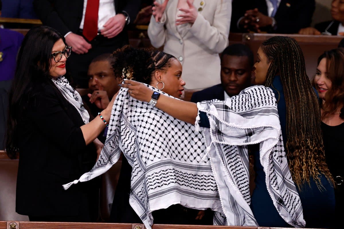 U.S. Representatives Rashida Tlaib (D-MI), Cori Bush (D-MO) and Summer Lee (D-PA) put on Palestinian keffiyehs prior to the State of the Union address at the US Capitol (REUTERS)