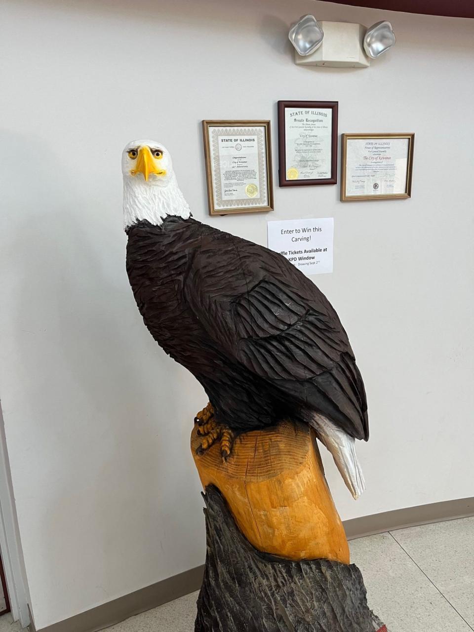 A chainsaw carving by Timothy Bryner, a police officer with the Kewanee Police Department and owner of Bryner's Chainsaw Carvings, will be raffled off with proceeds donated to the Welgat family.