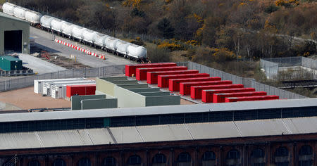 FILE PHOTO: A row of red-painted containers at the Lochaber aluminium smelter site, which is owned by companies controlled by Sanjeev Gupta's GFG Alliance, in Fort William, Scotland, Britain April 17, 2019. REUTERS/Russell Cheyne/File Photo