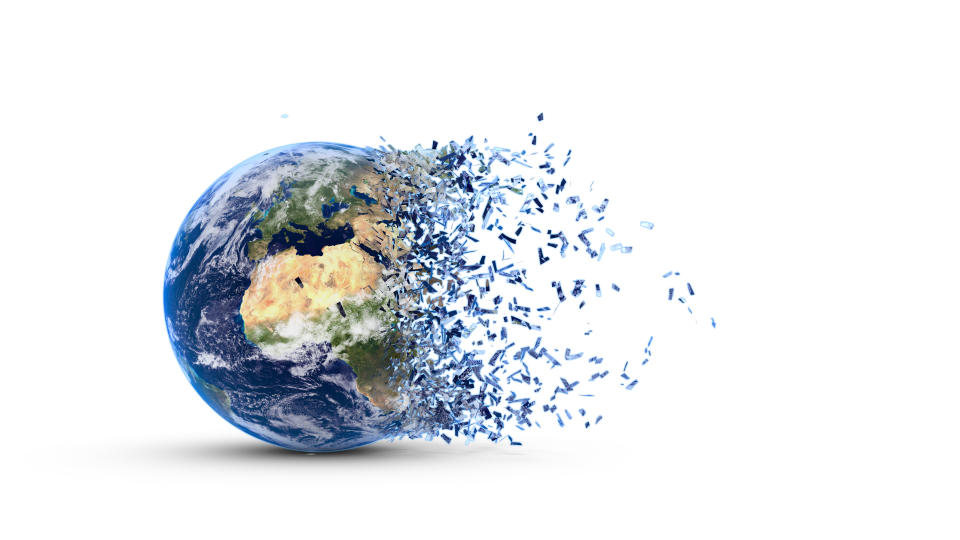 Disintegration of the world globe isolated on white background. Photo: Getty