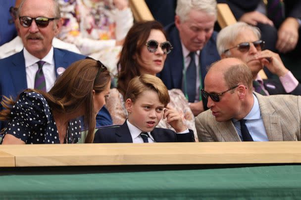 PHOTO:  The Duke and Duchess of Cambridge talk to their son Prince George as they attend the men's singles final tennis match between Serbia's Novak Djokovic and Australia's Nick Kyrgios at the 2022 Wimbledon Championships in London, July 10, 2022. (Sebastien Bozon/AFP via Getty Images)