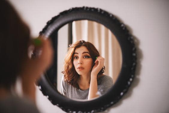 Woman applying mascara (iStock)