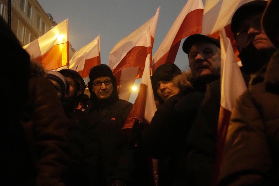 Supporters of right-wing Law and Justice party protest before the parliament building in Warsaw, Poland, on Thursday, Jan. 11, 2024. Law and Justice, frustrated over its recent loss of power, urged its supporters to protest moves by the new pro-European Union government to take control of state media. It also said it was protesting the arrests Tuesday of two senior members of Law and Justice, former Interior Minister Mariusz Kaminski and his former deputy, Maciej Wasik. (AP Photo/Czarek Sokolowski)