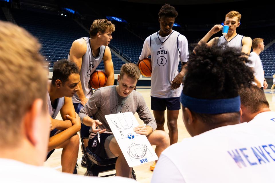Members of the media, BYU basketball players and members of the BYU coaching staff look at a play during a basketball game at Media Madness, an event hosted by the BYU program, at the Marriott Center in Provo on Monday, Oct. 9, 2023. | Megan Nielsen, Deseret News