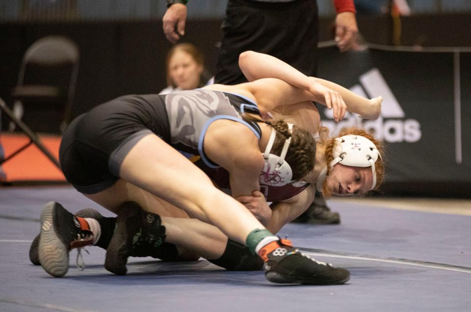 Seaman's Koti Best wrestles Olathe South's Nicole Redmond at 6-5A girls state wrestling. Best became the program's highest state placer this year and earned 1st team All-City honors.