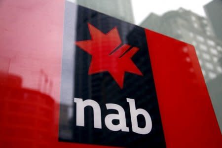 FILE PHOTO: A National Australia Bank (NAB) logo is pictured on an automated teller machine (ATM) in central Sydney September 12, 2014. REUTERS/David Gray/File Photo