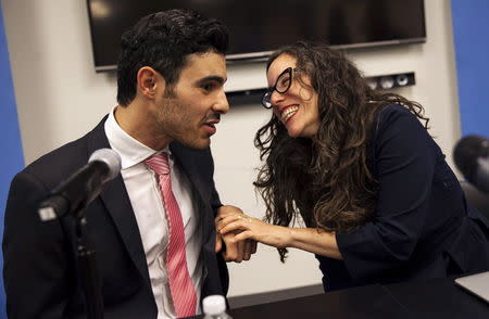 Gay Syrian refugee Subhi Nahas (L) confers with Jessica Stern, Executive Director of the International Gay & Lesbian Human Rights Commission (R) looks on, at a news conference at the United Nations headquarters in New York, August 24, 2015. REUTERS/Mike Segar