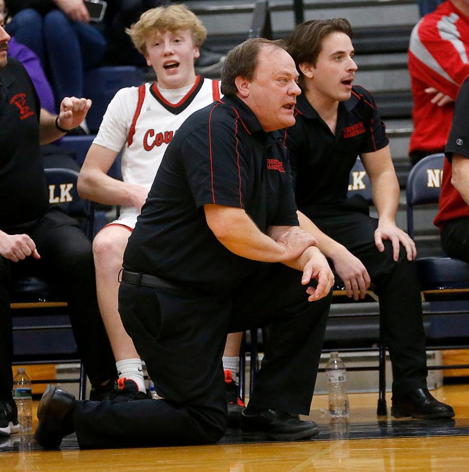 Crestview High School's head coach John Kurtz and his son assistant coach Kyle Kurtz, right, on the bench against Huron High School during their Division III district semifinal high school boys basketball game at Norwalk High School Wednesday, March 1, 2023. TOM E. PUSKAR/ASHLAND TIMES-GAZETTE